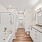 Bathroom with standing shower, soaking tub, dual vanities, and closet storage