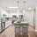 Luxury apartment for rent in Dedham, MA featuring white cabinetry, natural wood plank flooring, and a quartz kitchen island.