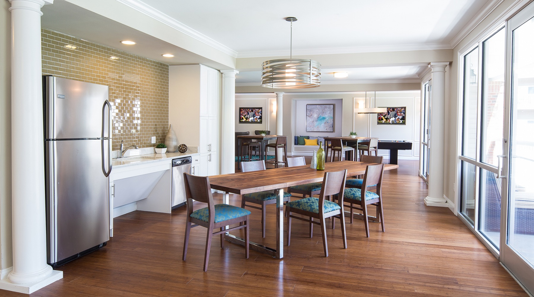 Parallax Community lounge area with long table and kitchen area