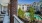 A balcony at our apartments in Dedham, featuring a view of the pool area and the rest of the apartment community.